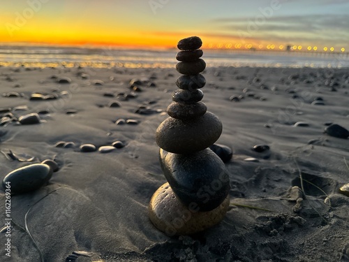 Tall rock stacking on the shore of the beach.
