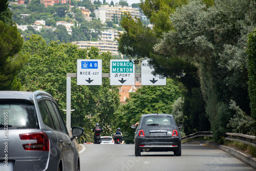 Driving car or camper on free on Cote d'azur, French Riviera in summer, road signs and directions, traffic jam on touristic road in France photo