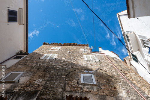 Fototapeta Naklejka Na Ścianę i Meble -  White old houses and narrow streets in medieval small touristic coastal town Sperlonga, Latina, vacation in Italy