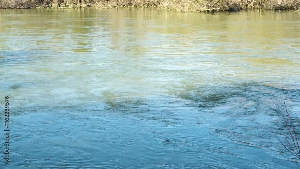 Whirlpools are forming in the Ebro river, creating mesmerizing patterns