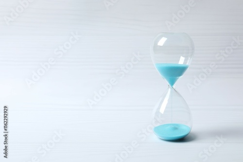 Modern hourglass on white background. Hourglass time concept for business deadline, urgency and outcome of time photo