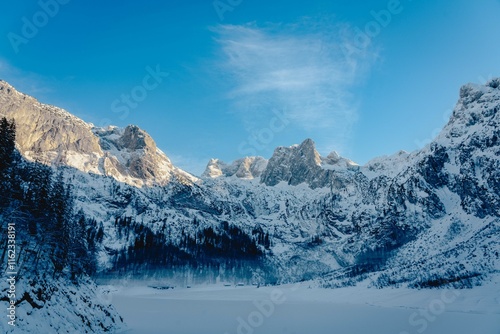 Mountain scenery in the Alps with Dachstein summit reflecting in Lake Gosausee, Salzkammergut, Austria in the Winter 