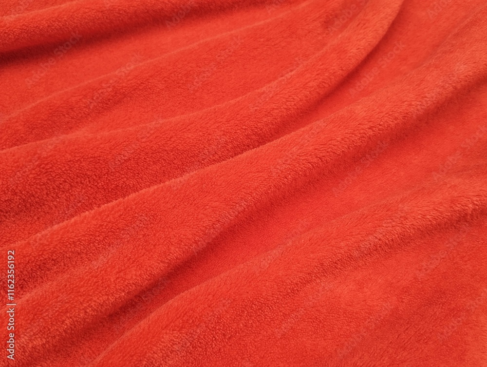 Abstrack red silk satin texture background. Beautiful wavy soft folds on the surface of the fabric. Abstrack red silk satin texture background. Beautiful wavy soft folds on the surface of the fabric.