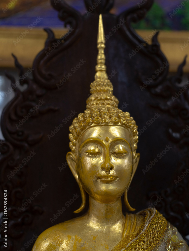 Golden Buddha statue in a Thai temple Golden Buddha statue in a Thai temple