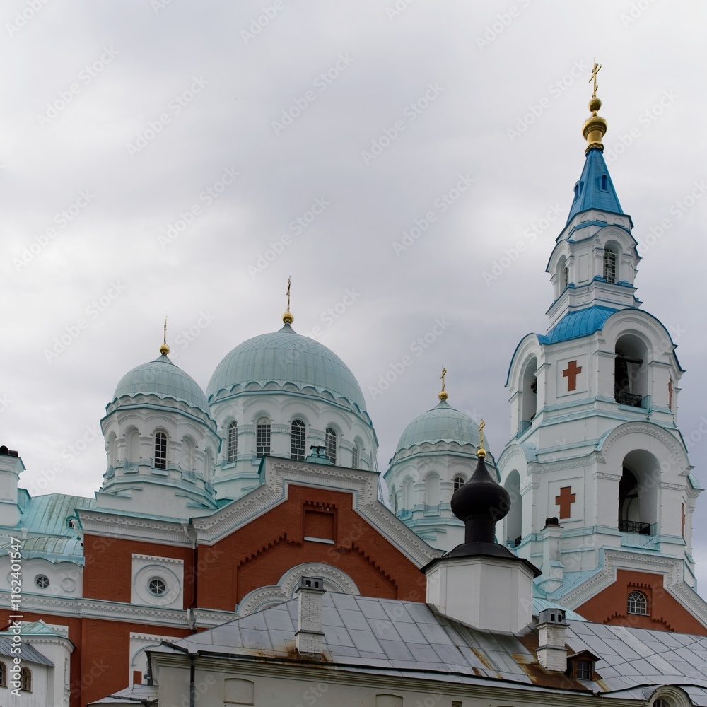 Obraz premium Valaam Island, Russia, July 12, 2024. Domes and crosses against a rainy sky. 