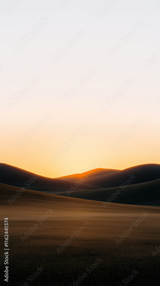 Majestic golden sun setting over rolling green hills, casting long shadows across the landscape. Majestic golden sun setting over rolling green hills, casting long shadows across the landscape.