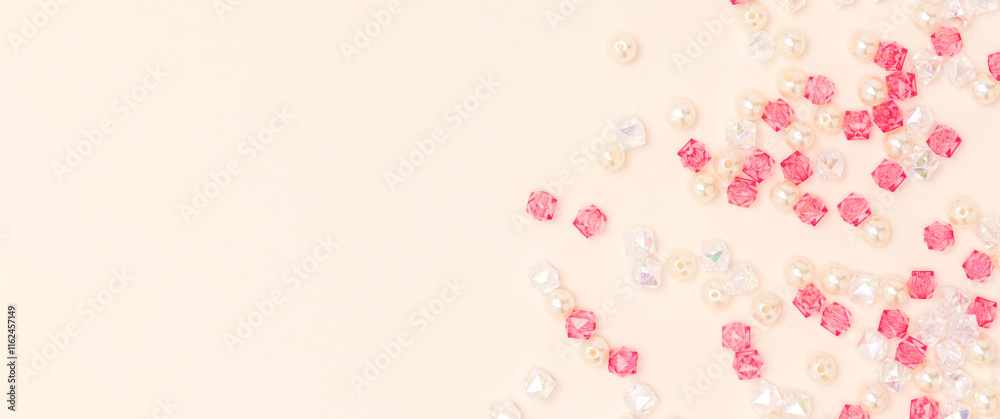Banner with acrylic beads on a beige background with copy space. Banner with acrylic beads on a beige background with copy space.