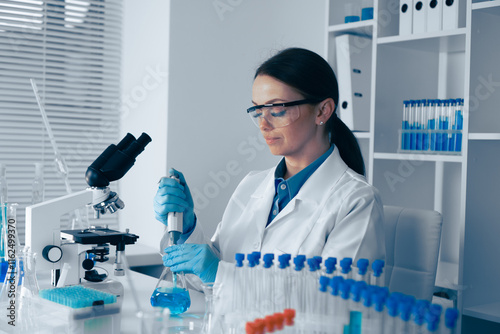 Fotografie A dedicated scientist conducts impactful research in a modern lab, using cutting