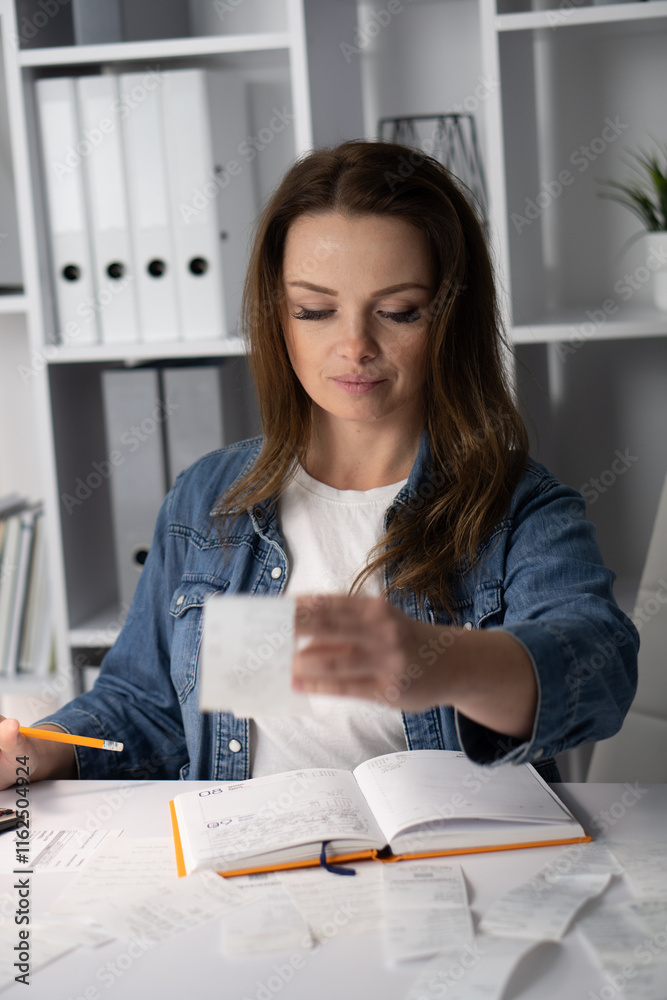In a modern home office, a focused young woman organizes her receipts and documents, creating an efficient workspace that enhances productivity and reflects her organized, careerdriven lifestyle In a modern home office, a focused young woman organizes her receipts and documents, creating an efficient workspace that enhances productivity and reflects her organized, careerdriven lifestyle