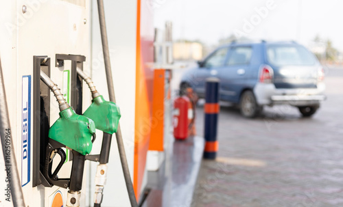 Selective focus on fuel pump nozzles of a fuel station of India