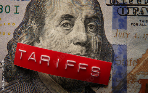 Red Tariffs label on a hundred dollar bill photo