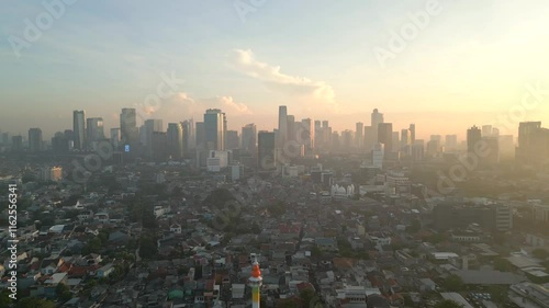 Aerial view of air-polluted Jakarta city skyline at dawn, Indonesia