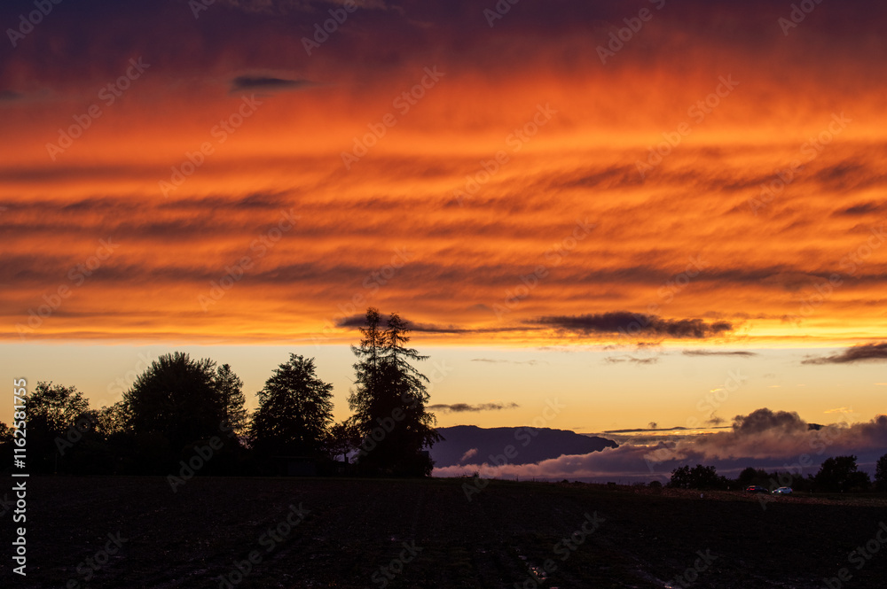 Obraz premium Magical sunset in the low mountains. Mists