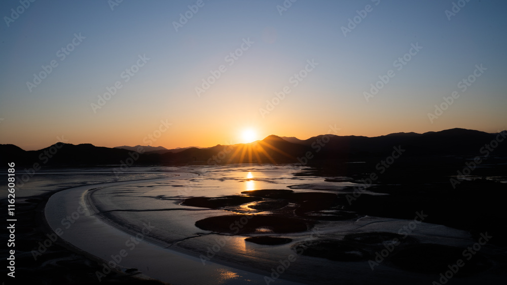 Fototapeta premium Sunrise Over Serene Wetlands suncheon bay