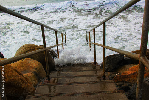 Ocean Waves Crashing Against Staircase