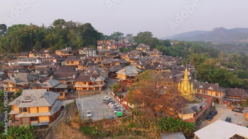 Early morning aerial views of Yunnan Jingmai Mountain Ancient Village showcasing tranquil landscape and historical architecture photo