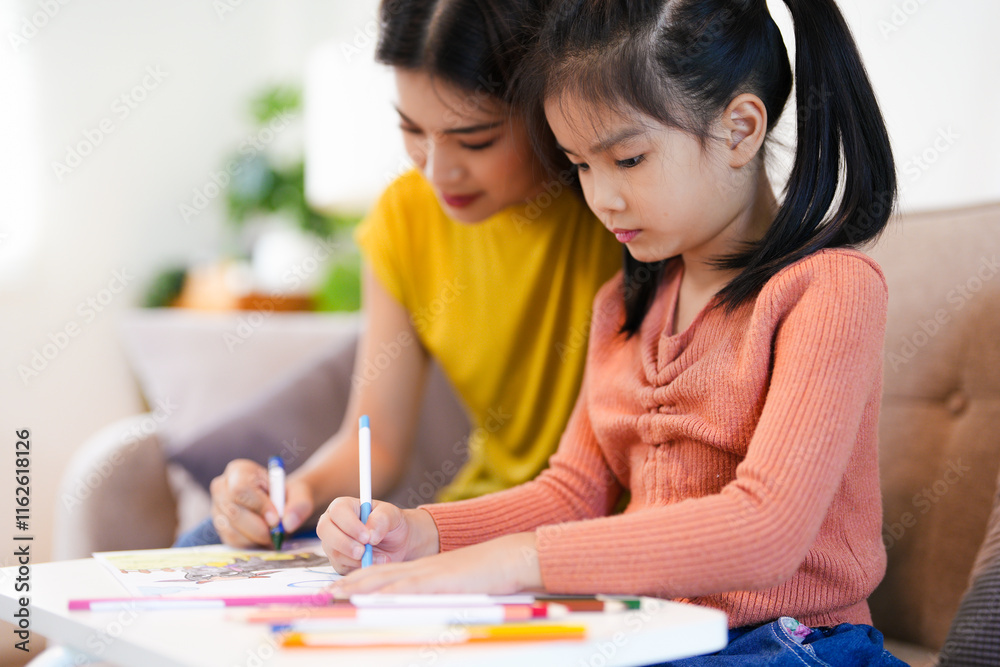 modern mother joining homework together with daughter, happy time in living home and comfortable feel free modern mother joining homework together with daughter, happy time in living home and comfortable feel free