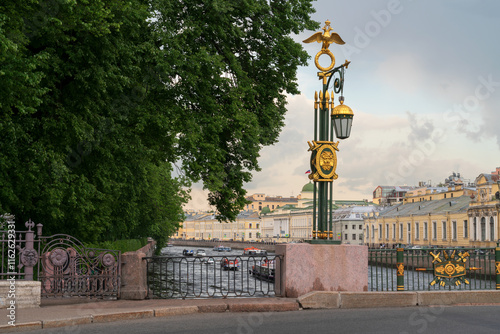 Gilded lantern on the Panteleimon Bridge over the Fontanka River on a summer day, Saint Petersburg, Russia photo