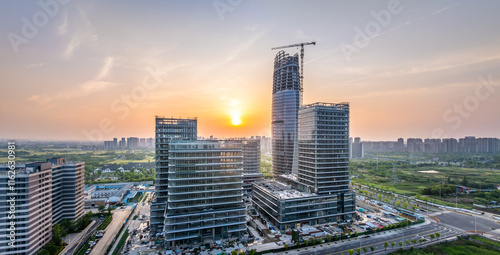 Photography Modern city commercial building construction site at sunrise