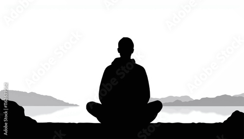 Silhouette of a person meditating by a calm lake