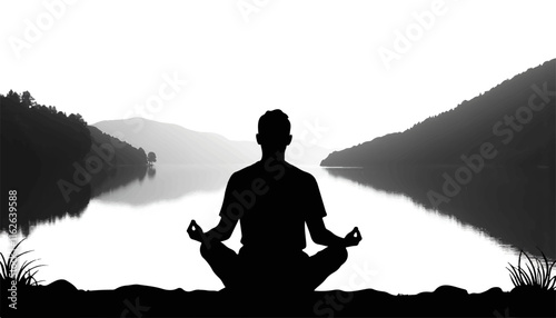 Silhouetted person meditating by serene lake