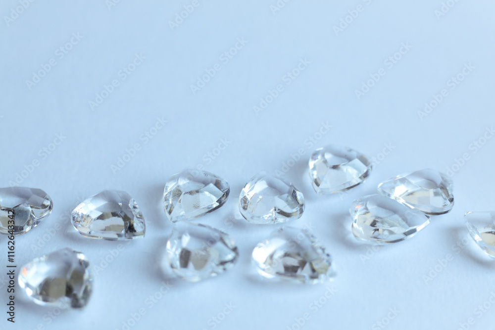 Diamonds on a white background. Macro photo with shallow depth of field. Diamonds on a white background. Macro photo with shallow depth of field.
