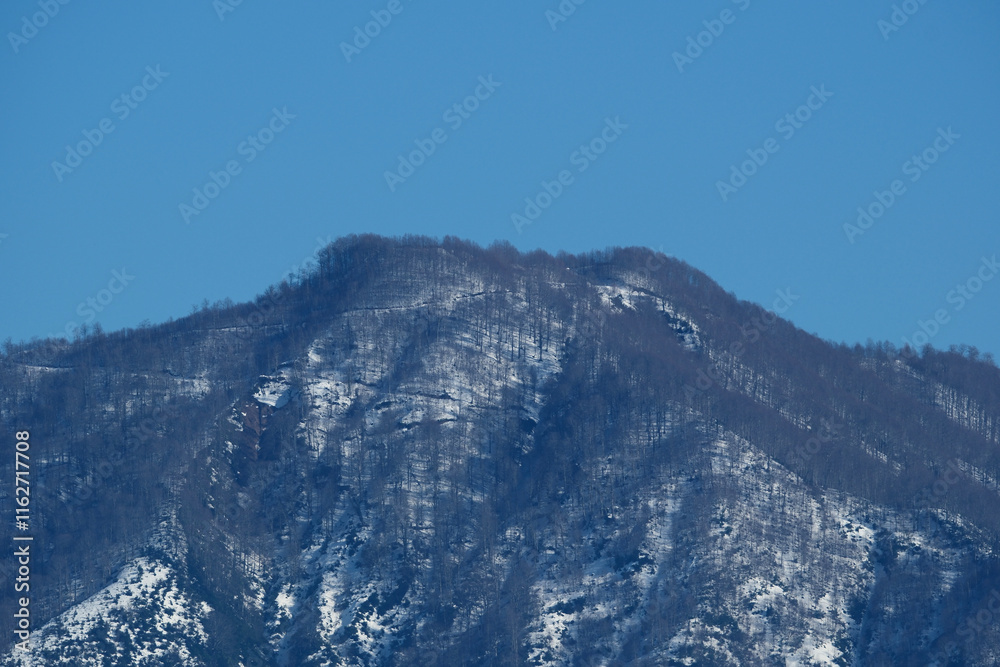 Mountain covered with snow on a sunny winter day in Georgia Mountain covered with snow on a sunny winter day in Georgia
