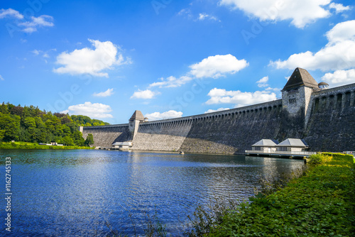 View of the historic dam wall at Möhnesee. Möhne Dam with the surrounding nature.
