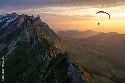 Paragliding at sunset over Schäfler Ridge, Switzerland
