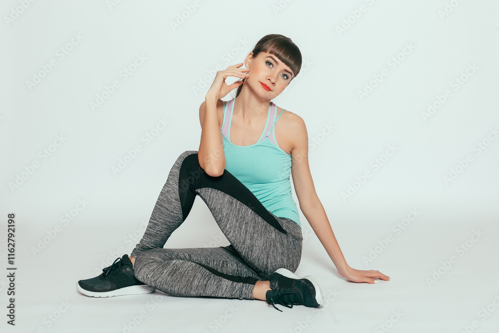 Fitness model in gray sportswear. Healthy lifestyle. Fitness model in gray sportswear. Healthy lifestyle.