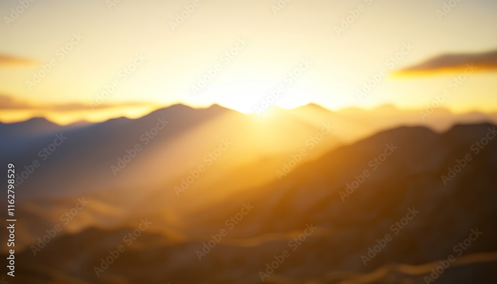 Fototapeta premium A serene sunrise over a mountain range, capturing soft light and tranquil beauty in nature's backdrop.