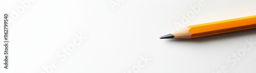 A simple, clean image of a yellow pencil resting on a white surface, ideal for design and educational projects. photo