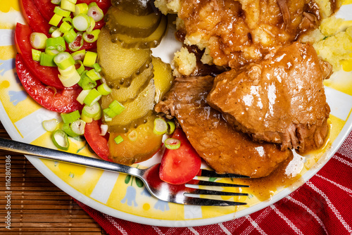 Stewed pork in its own sauce. photo