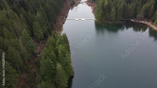 Wallpaper Mural Cloudy skies and green mountains reflecting on a quiet, still lake Torontodigital.ca
