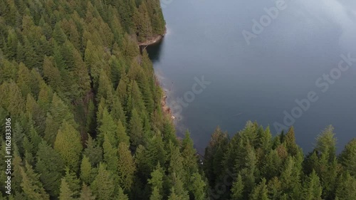 Wallpaper Mural A soothing flight over a peaceful lake and green mountains on an overcast day Torontodigital.ca