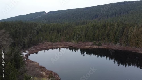 Wallpaper Mural Above the lake’s quiet waters and misty green mountains under gray skies Torontodigital.ca