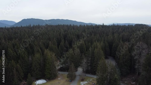 Wallpaper Mural Exploring nature’s beauty from above: a lake shore and mountains on a cloudy day Torontodigital.ca