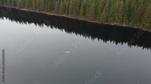 Wallpaper Mural Capturing the stillness of a quiet lake and forested mountains on a cloudy day Torontodigital.ca