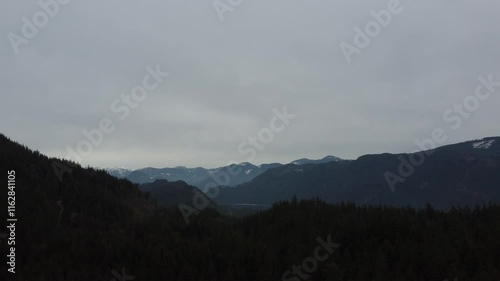 Wallpaper Mural Floating gently over a quiet valley and misty forested peaks Torontodigital.ca