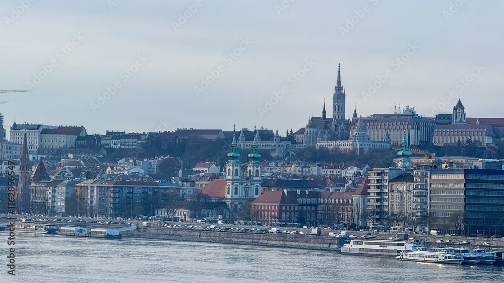 Fototapeta premium Panoramic view of Budapest's historic skyline along the Danube River, highlighting architectural beauty and European travel during Easter