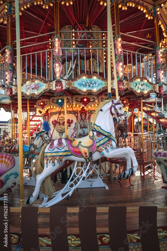Fotografia Carousel with colorful horses, Merry go round with horse, Vintage ride attractio