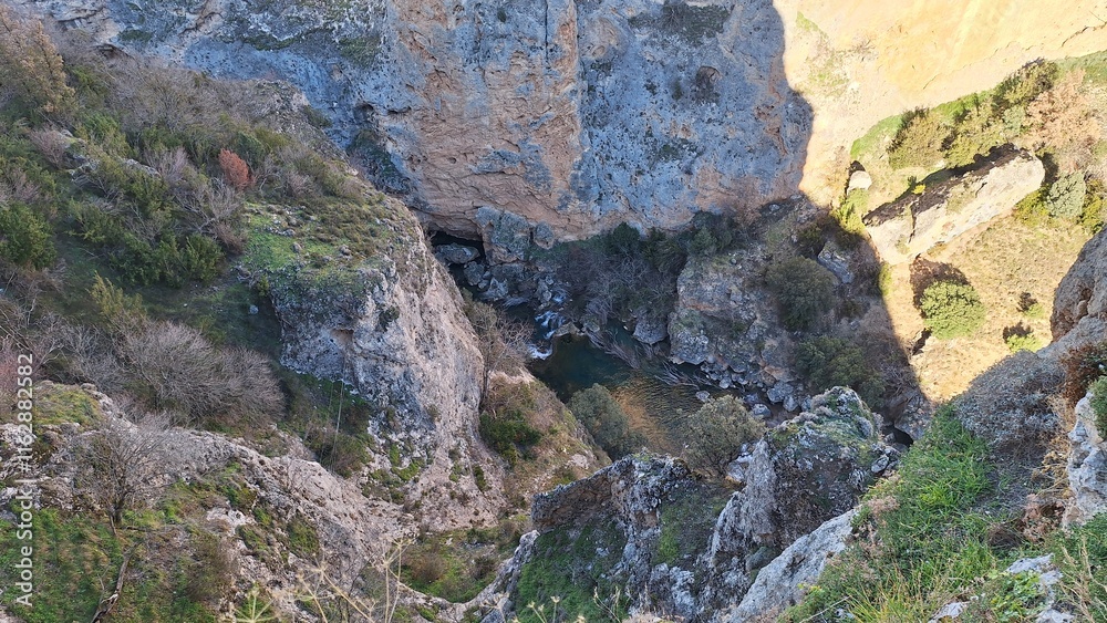 The Ventano del Diablo viewpoint overlooking the Júcar River gorges in the mountains of Cuenca, Castilla-La Mancha, Spain, offering breathtaking natural scenery. The Ventano del Diablo viewpoint overlooking the Júcar River gorges in the mountains of Cuenca, Castilla-La Mancha, Spain, offering breathtaking natural scenery.