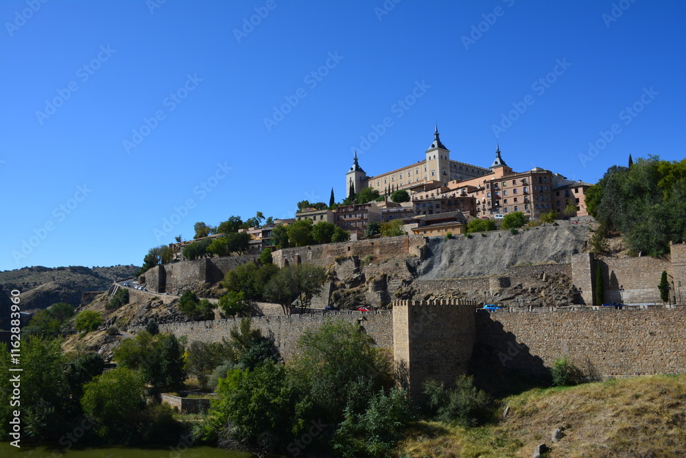 Fototapeta premium A journey through Madrid, Toledo, Segovia, and El Escorial offers a captivating blend of history, architecture, and cultural treasures. Start in Madrid, Spain's vibrant capital, exploring landmarks li
