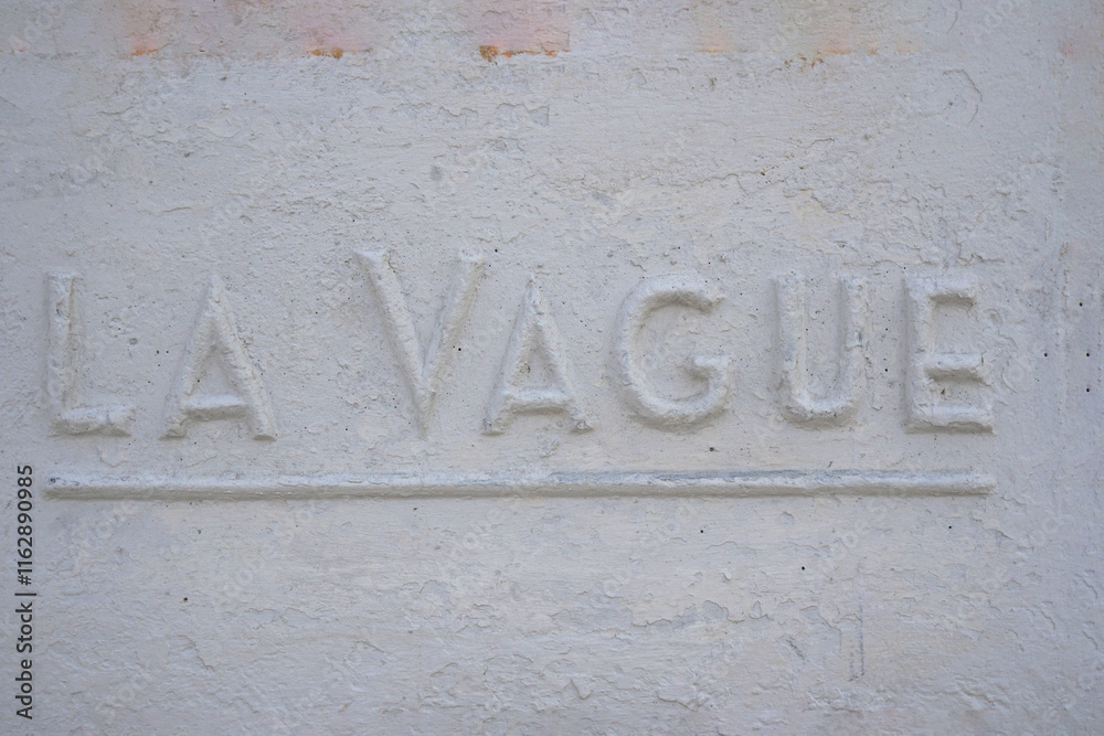 La vague white insignia letter La vague white insignia letter