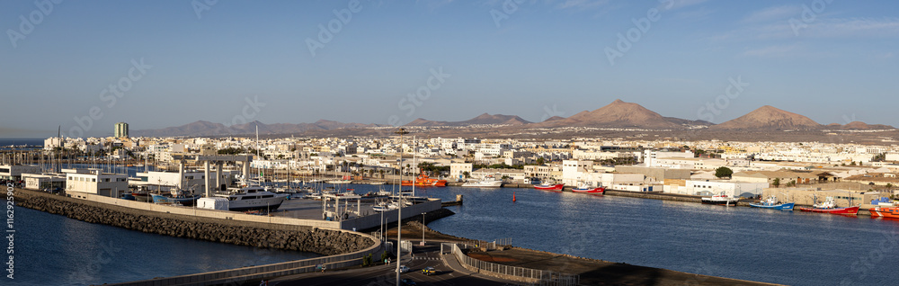 Panoramic photo of the harbor in Lanzarote, in the Canary Islands in Spain on a sunny morning Panoramic photo of the harbor in Lanzarote, in the Canary Islands in Spain on a sunny morning