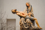 Pieta, Saint Mary supporting the body of crucified Christ. Beautiful Piet type, medieval sculpture, 1400 year