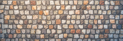 Square cobblestone paving with earthy tones and texture
