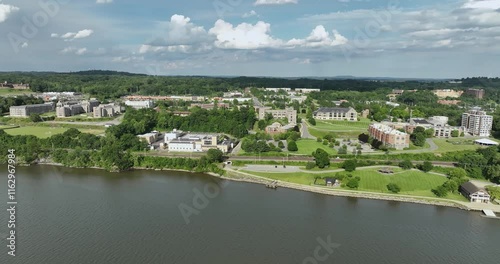 Poughkeepsie, NY, USA - 06-29-2022:  Summer afternoon aerial drone video of the east side of the Hudson River, Poughkeepsie, NY.	
