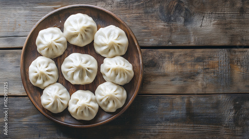 Georgian dish khinkali, freshly prepared with plump, arranged on a rustic wooden table