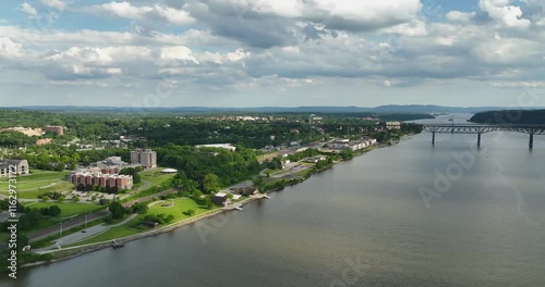 Poughkeepsie, NY, USA - 06-29-2022:  Summer afternoon aerial drone video of the east side of the Hudson River, Poughkeepsie, NY.	